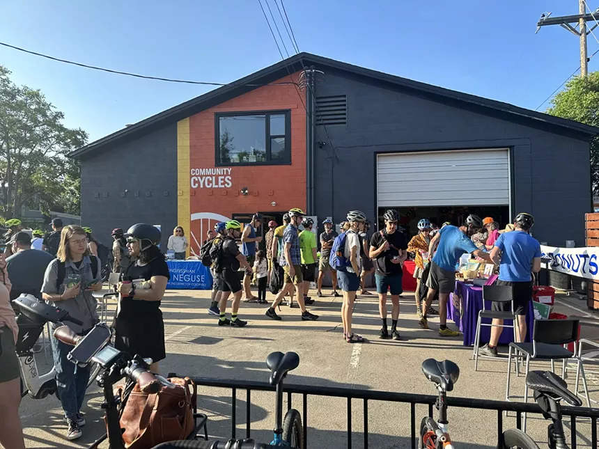A crowd outside of Community Cycles on Walk and Bike to Work Day