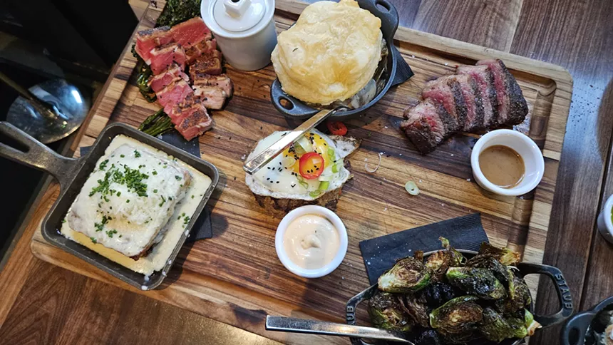 lots of restaurant dishes on a wooden board