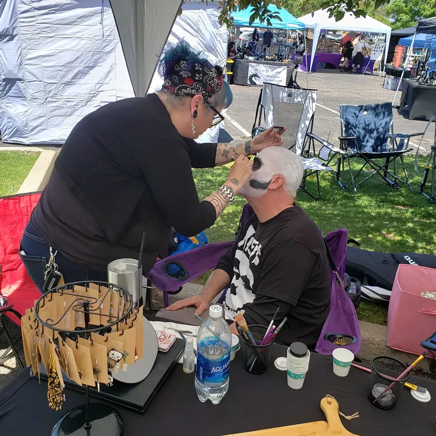 A man gets his face painted