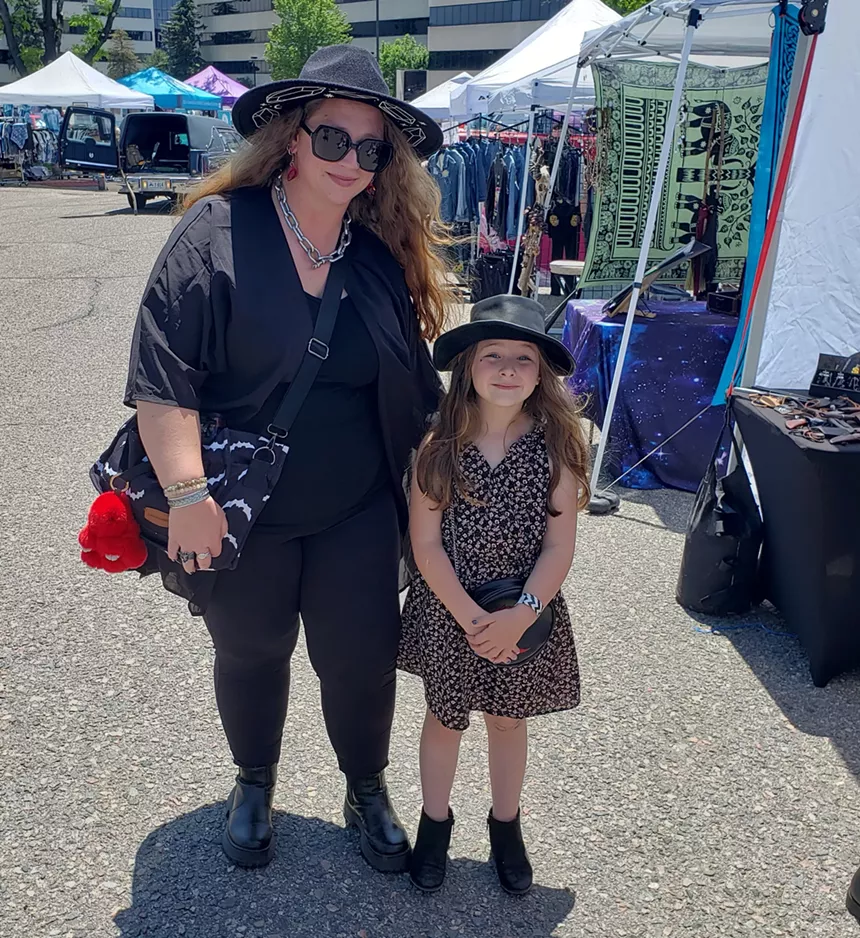 A woman and girl in black clothing