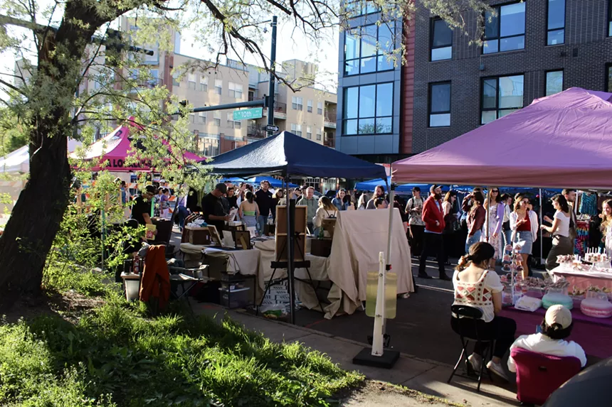 People check out vendor booths