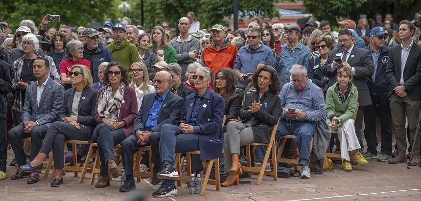 crowd listens to speeches