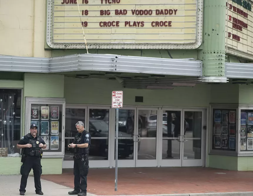 police in front of theater