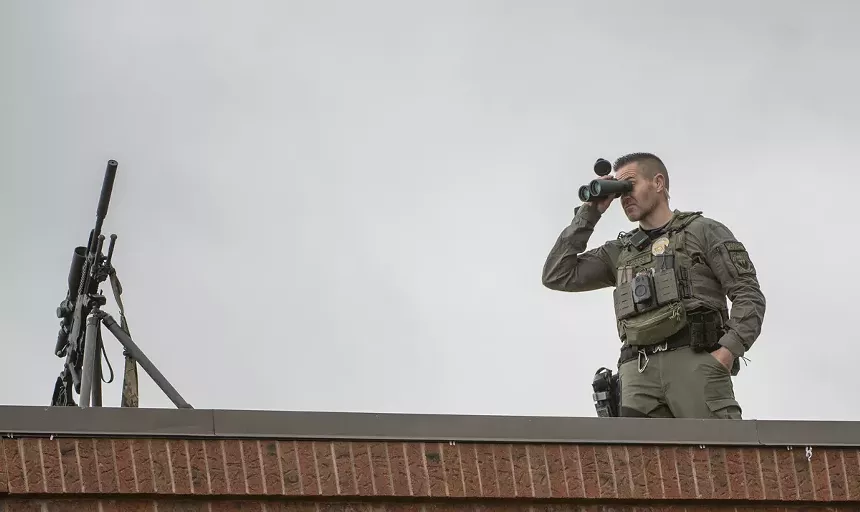 swat member with binoculars