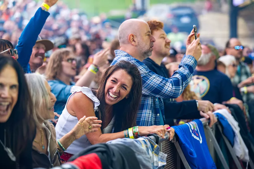 Lady smiling at Goose concert