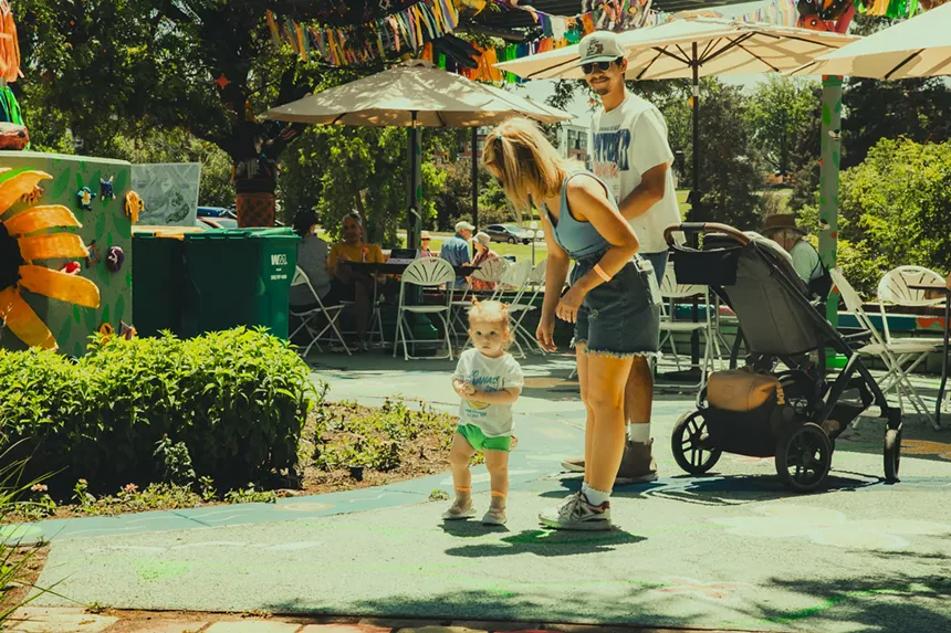A couple enjoys the art installations at Indiewood Street Festival.