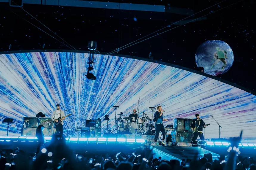 Coldplay on stage at Empower Field at Mile High.