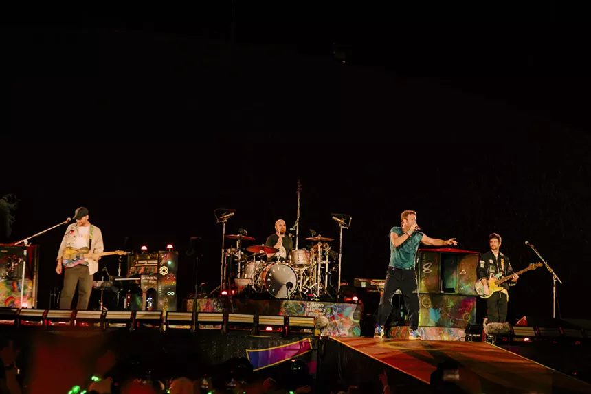 Coldplay on stage at Empower Field at Mile High.