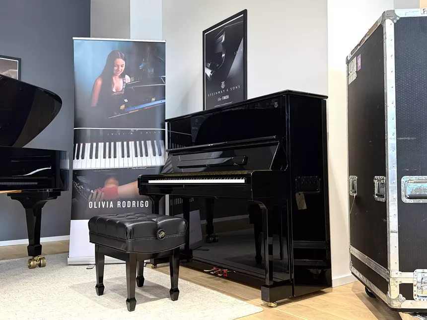 a piano and a photo of Olivia Rodrigo