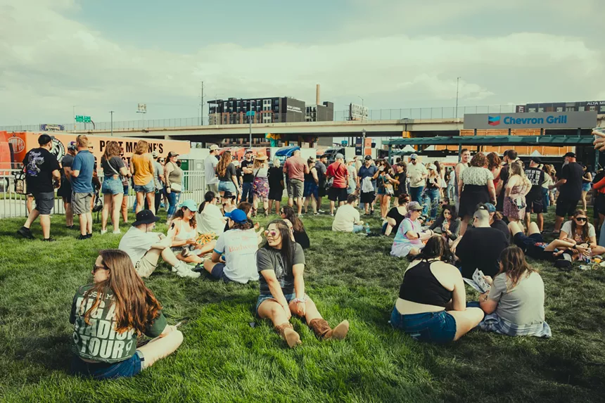 Fans relaxing before the show at Post Malone's travelin' tailgate.