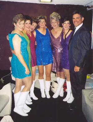 A group of women wear sparkly dresses