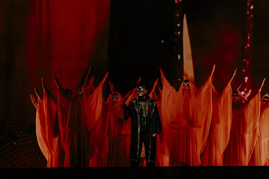 The Weeknd with dancers on stage at Empower Field at Mile High for his After Hours Til Dawn Tour on Saturday, June 21.