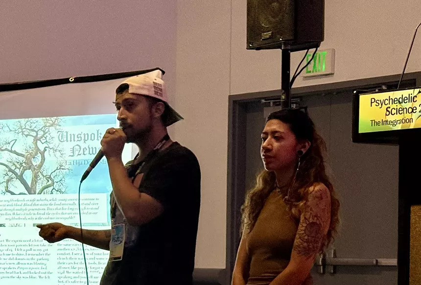Mario Reyes and Honey Buendía of the Dystopian Times collective during their presentation at Psychedelic Science 2025