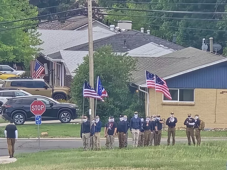 Patriot Front members line up to protest a drag queen story hour in Arvada