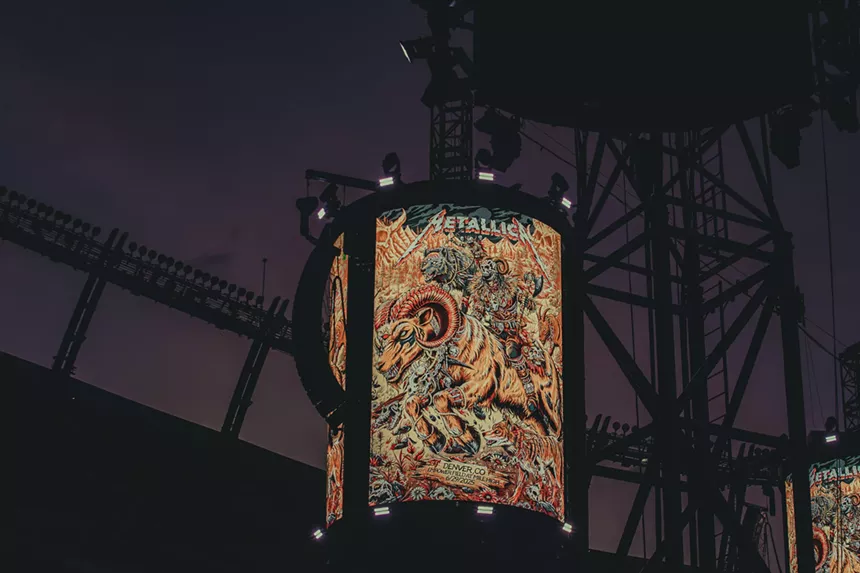 Metallica artwork for night two on display on one of their production towers.