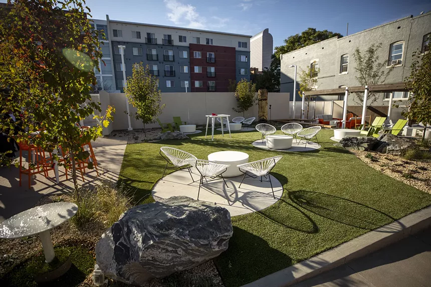 outdoor patio with seating and lawn