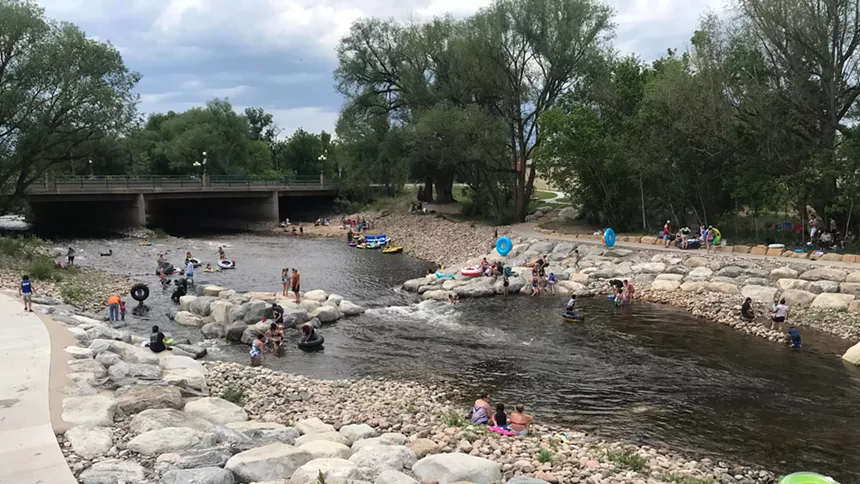 People float and relax in a river