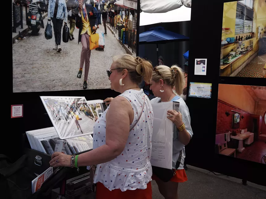 A woman looks through photos