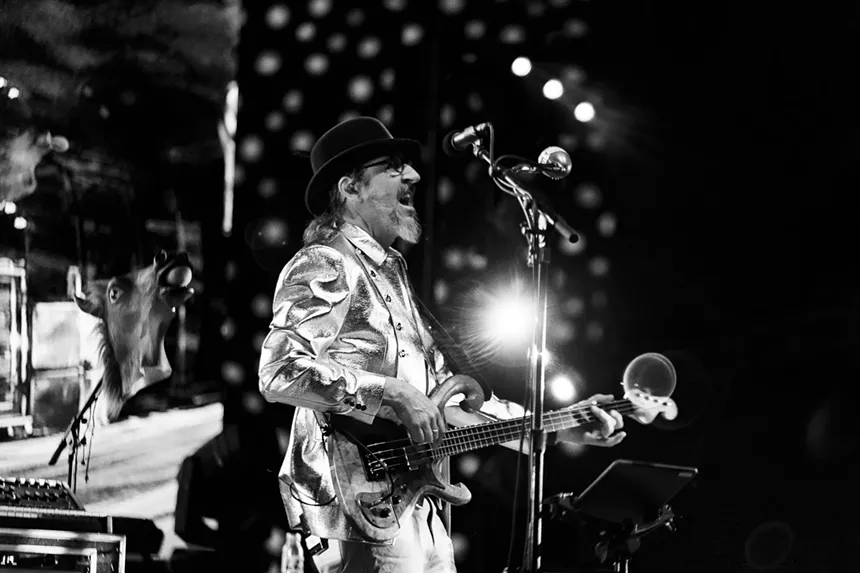 Les Claypool performing on stage at Red Rocks.