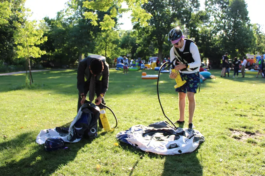 People inflating inner tubes.