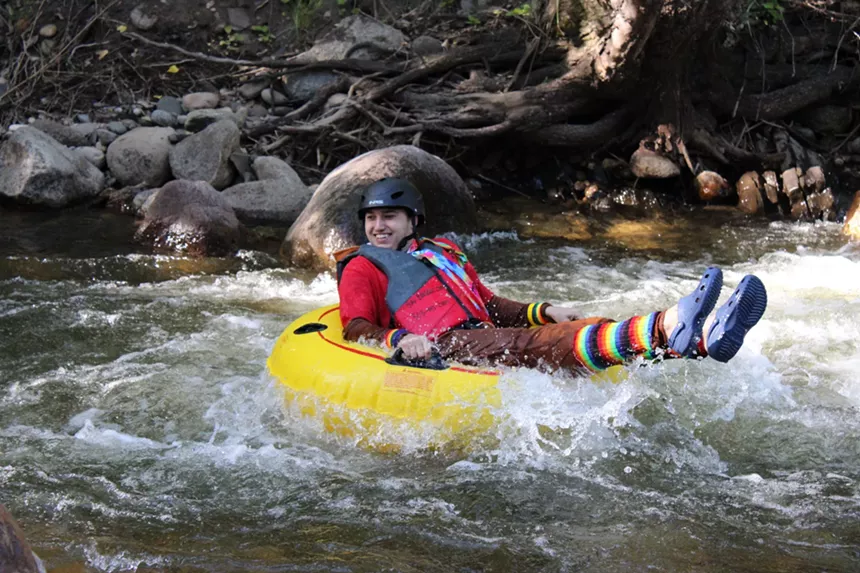 A person tubes.