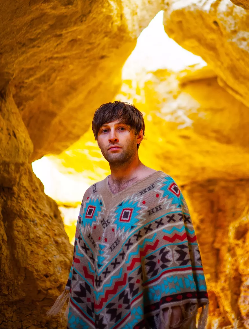a man in a poncho