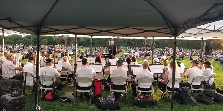 people watching the Denver Municipal Band outdoors