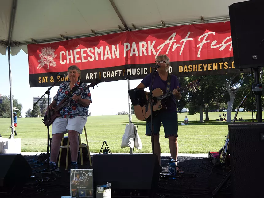 two woman play bass and guitar