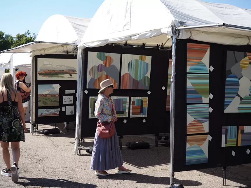 a woman looks at art