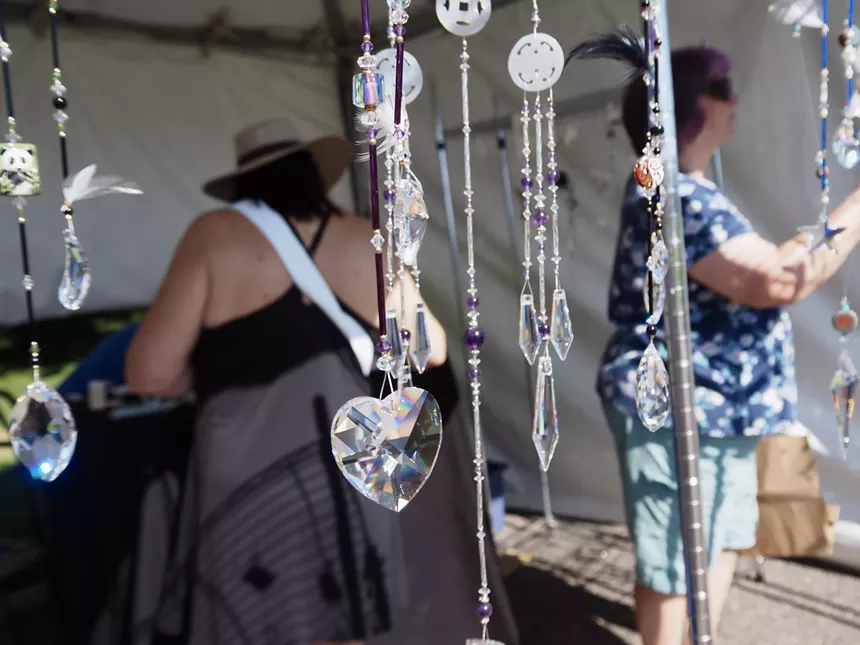 People look at sparkely beaded strings