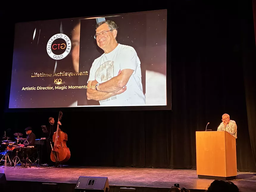 A person accepts an award