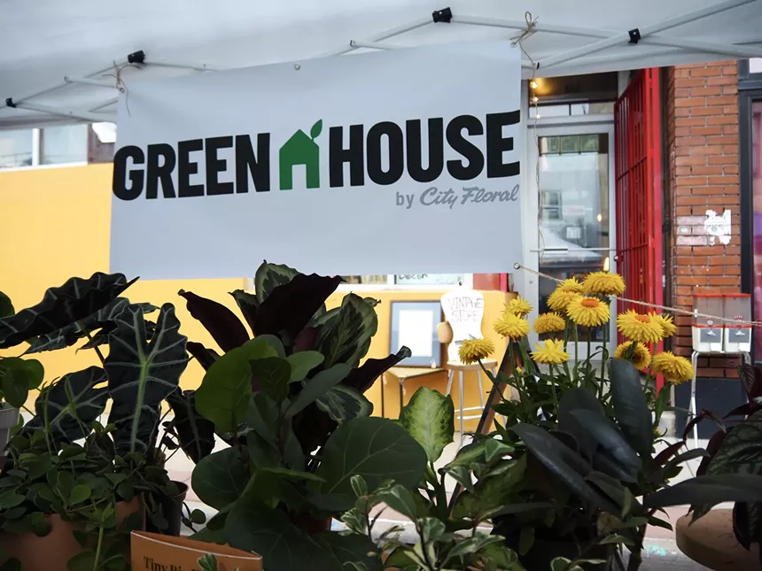 A booth with plants in it