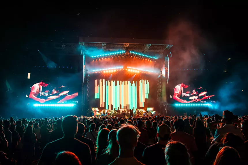 The Lumineers on stage at Empower Field