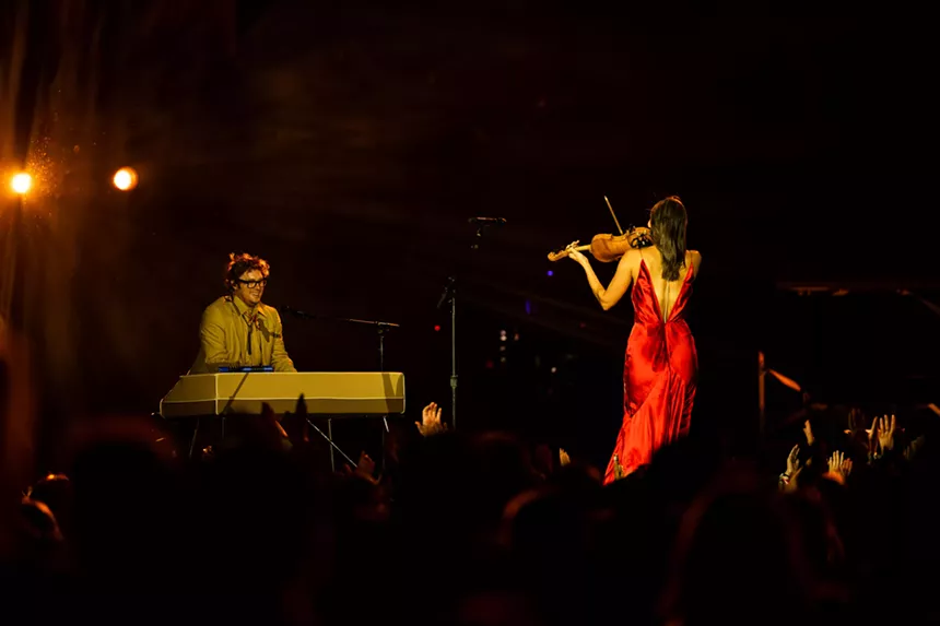 The Lumineers on stage at Empower Field