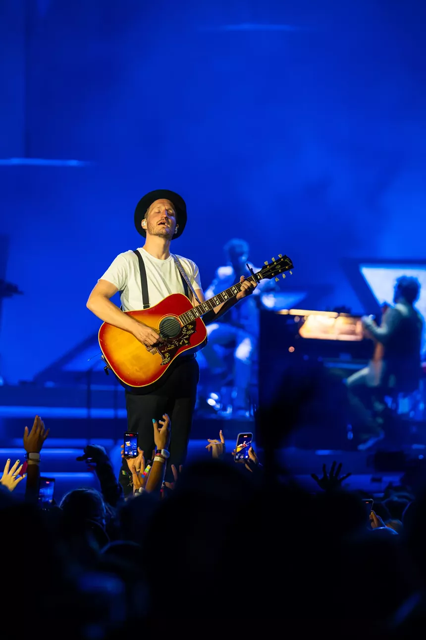 The Lumineers on stage at Empower Field