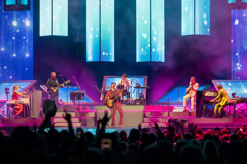 The Lumineers on stage at Empower Field