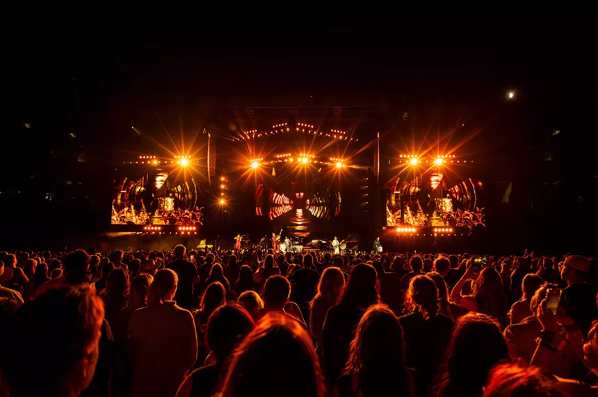 The Lumineers on stage at Empower Field