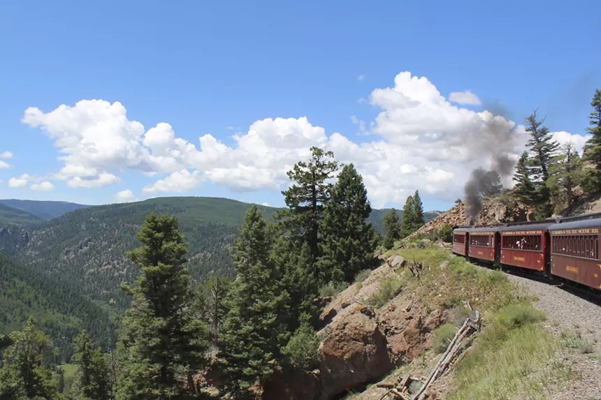 The Cumbres & Toltec Scenic Railroad train rounding a bend in the mountains