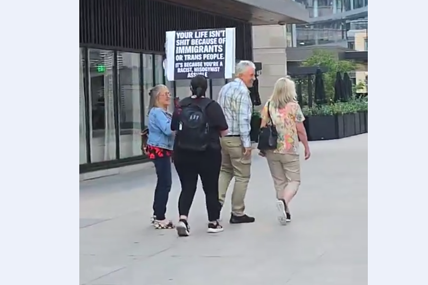 A protester harasses people.
