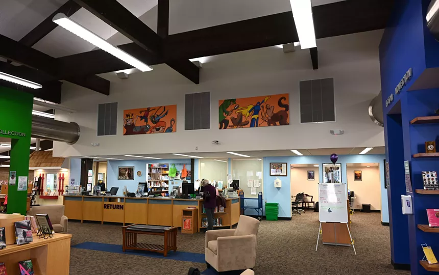 Woman checks out books at the Mission Viejo Library.