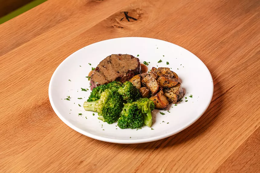 A Beyond Steak filet served with herb-roasted potatoes and broccoli