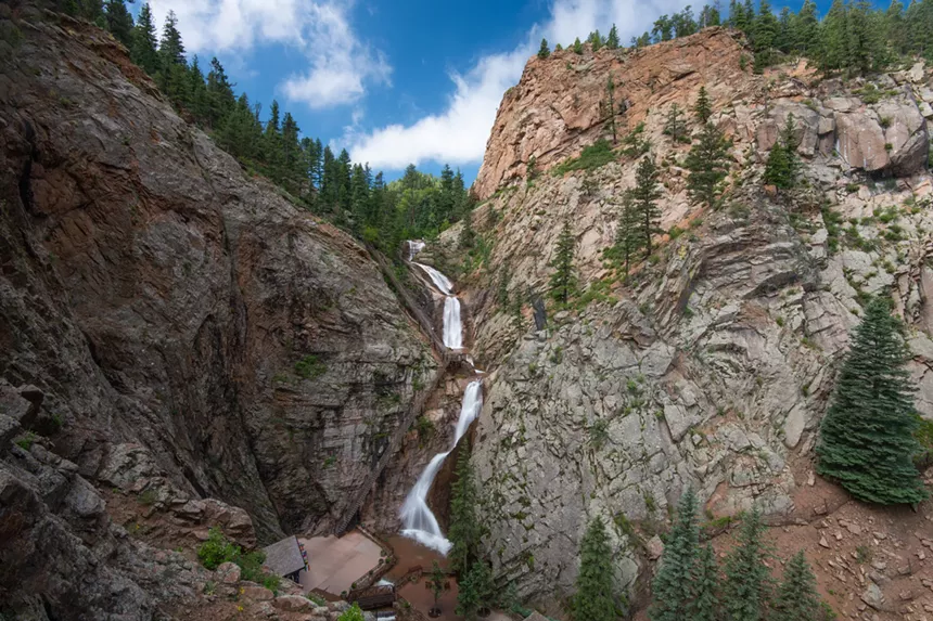 Seven Falls, a 181-foot waterfall, cascading between rocky granite walls