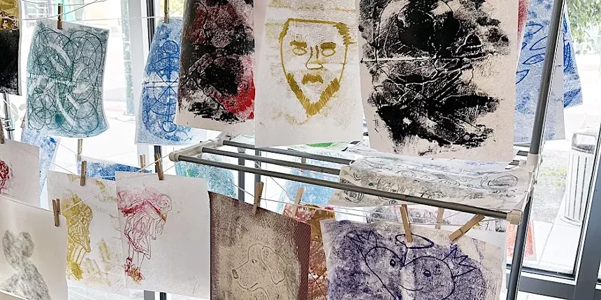 carved prints of faces