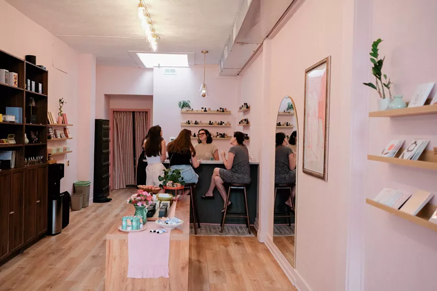 People sit at a counter for a consultation