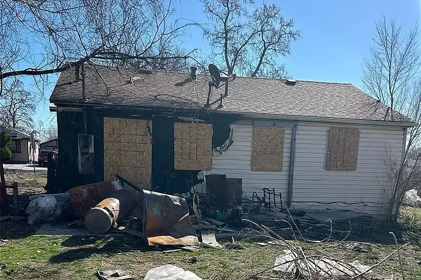abandoned home with windows boarded
