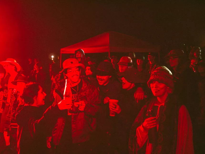 people smiling at a music festival