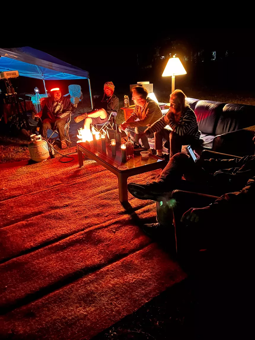 people in an outdoor living room