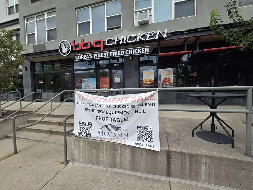 "retirement sale" banner hanging in front of a restaurant