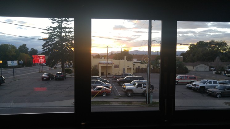 The view of the mountains, and the dental clinic next door, from upstairs at Colorado Plus. - SARAH MCGILL