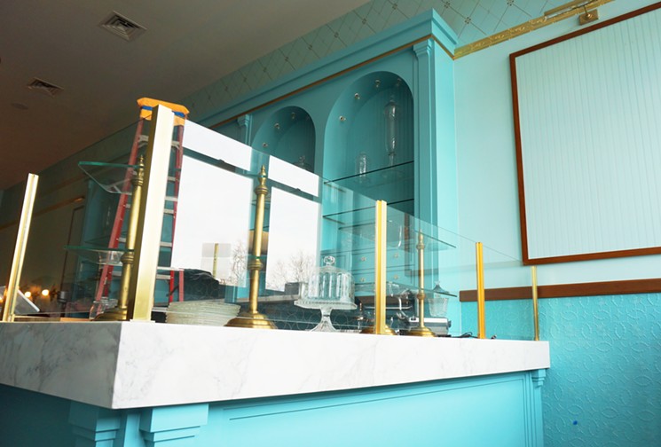 Last-minute touches are being completed inside the elegant, old-fashioned ice cream parlor. - MARK ANTONATION